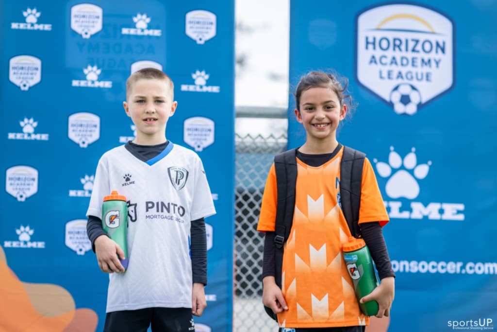 Two Horizon Academy League youth soccer players at a league event